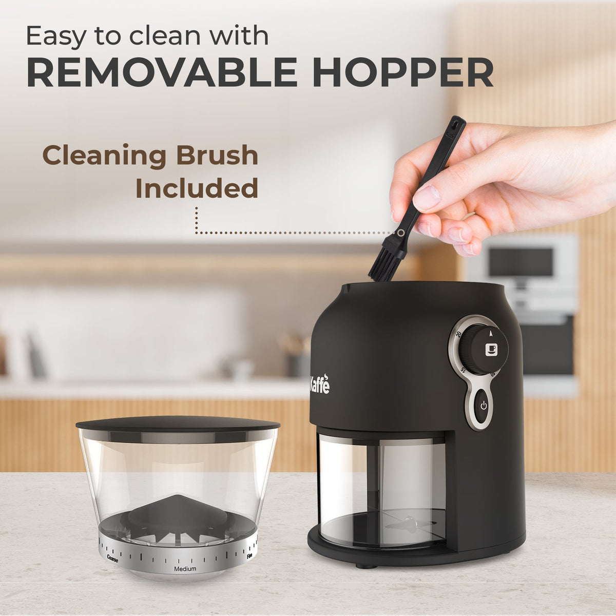Kaffe KF8150 with hopper removed and a brush cleaning the grinder opening