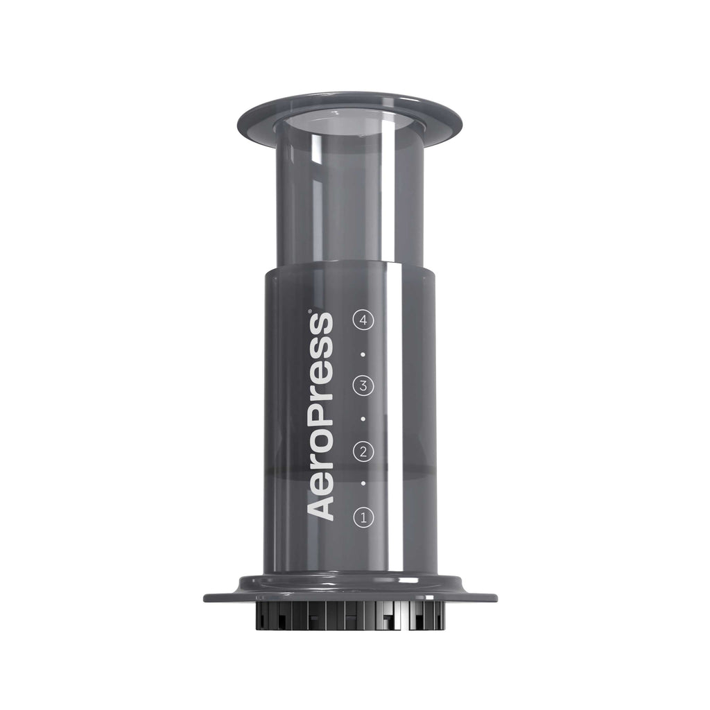 AeroPress Original coffee brewer with clear chamber, plunger and filter cap, on a white background.