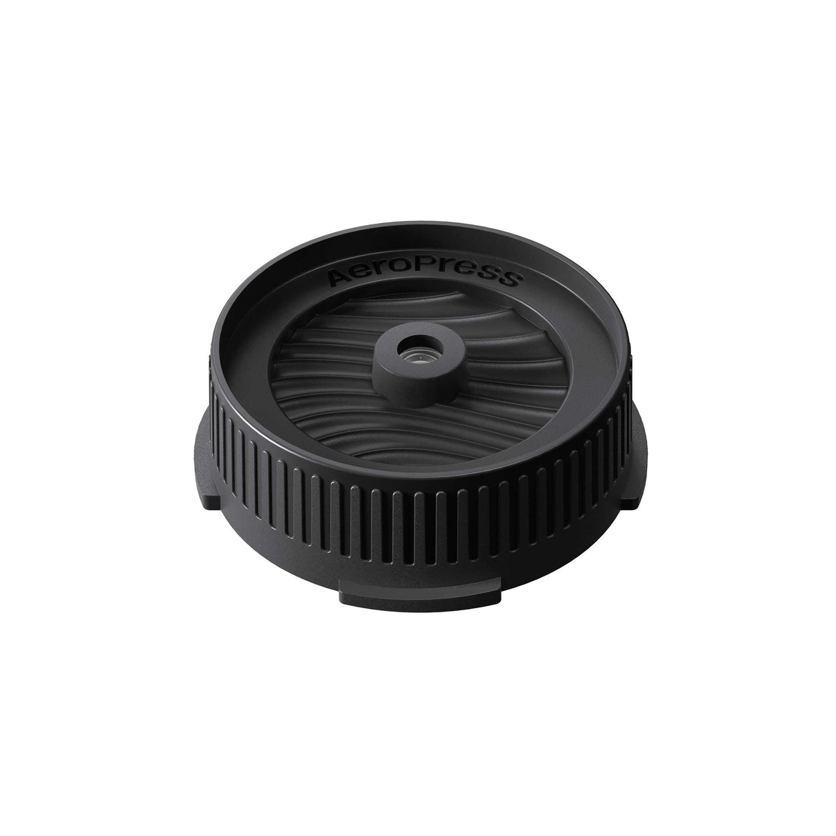 AeroPress Flow Control Filter Cap in black, shown at an angle on a white background.