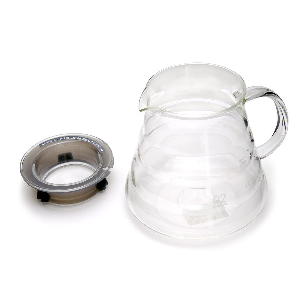 Hario V60 range server 02 with its stainless steel lid removed and placed beside it.