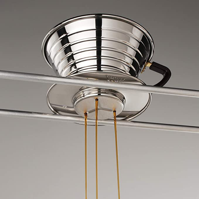 Close-up of a Kalita Wave 185 dripper on a server, with three streams of coffee draining from its flat base; server not included.
