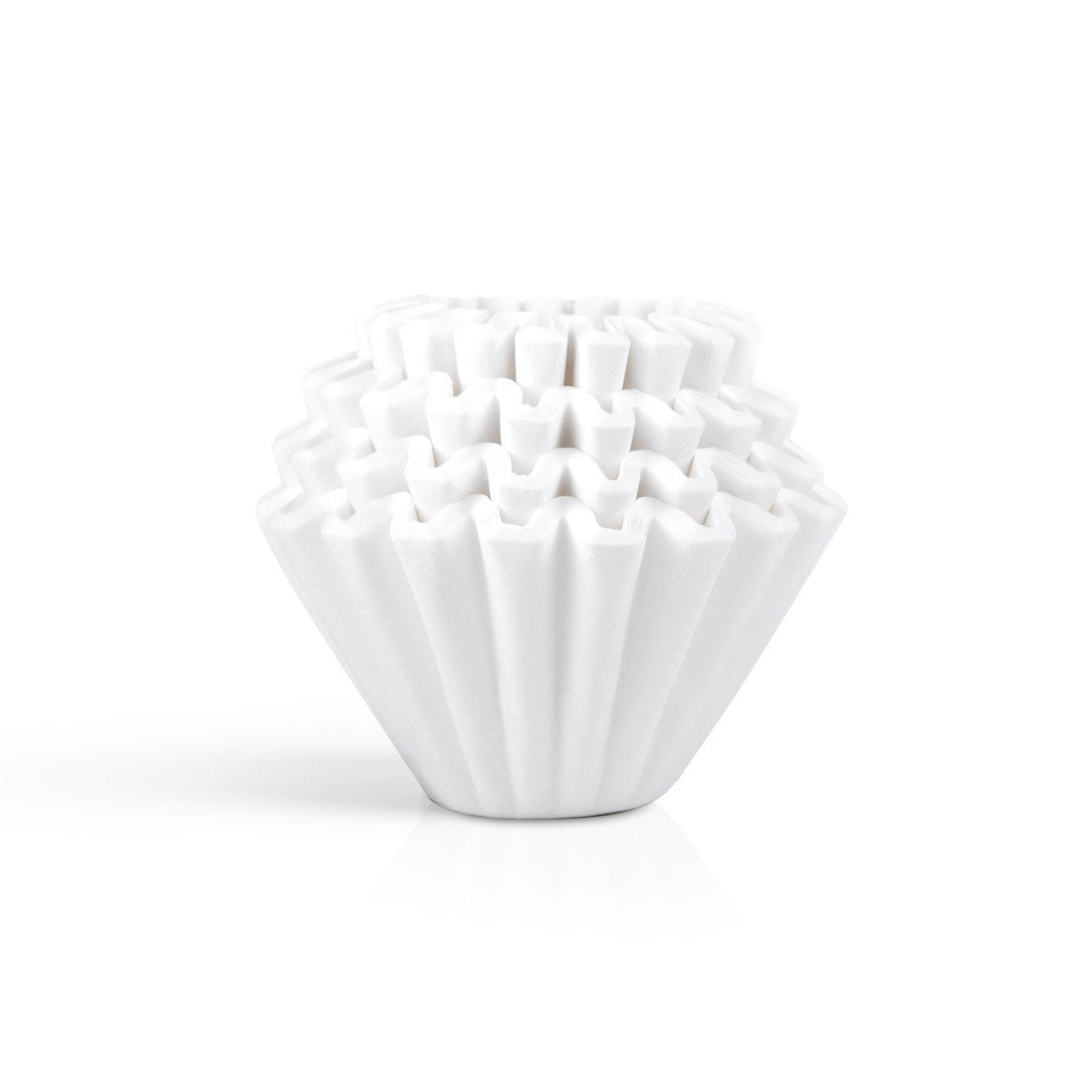Stack of white Kalita Wave 185 paper filters on a white background.