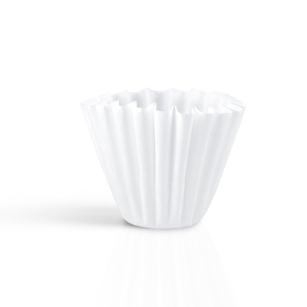 Single white Kalita Wave 185 paper filter standing on a white background.