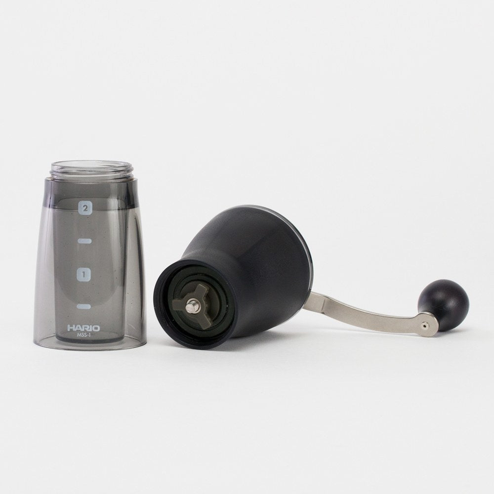 Hario Mini Slim+ grinder with grounds container removed to show the ceramic burr assembly