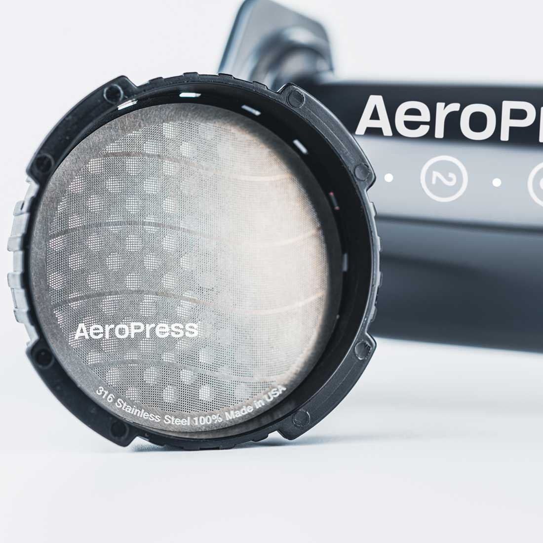 AeroPress standard stainless steel reusable filter fitted inside a filter cap; brewer and cap sold separately